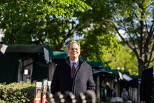 Treasury Secretary Scott Bessent walking to a interview at the White House